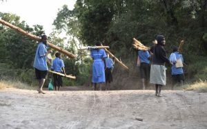 kids bring wood to school in the morning to heat!: uganda on the road again-pictures by albi