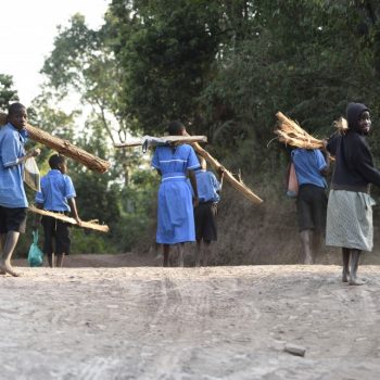 kids bring wood to school in the morning to heat!: uganda on the road again-pictures by albi