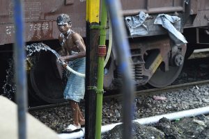 living india: take a shower at the railway station