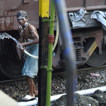 living india: take a shower at the railway station
